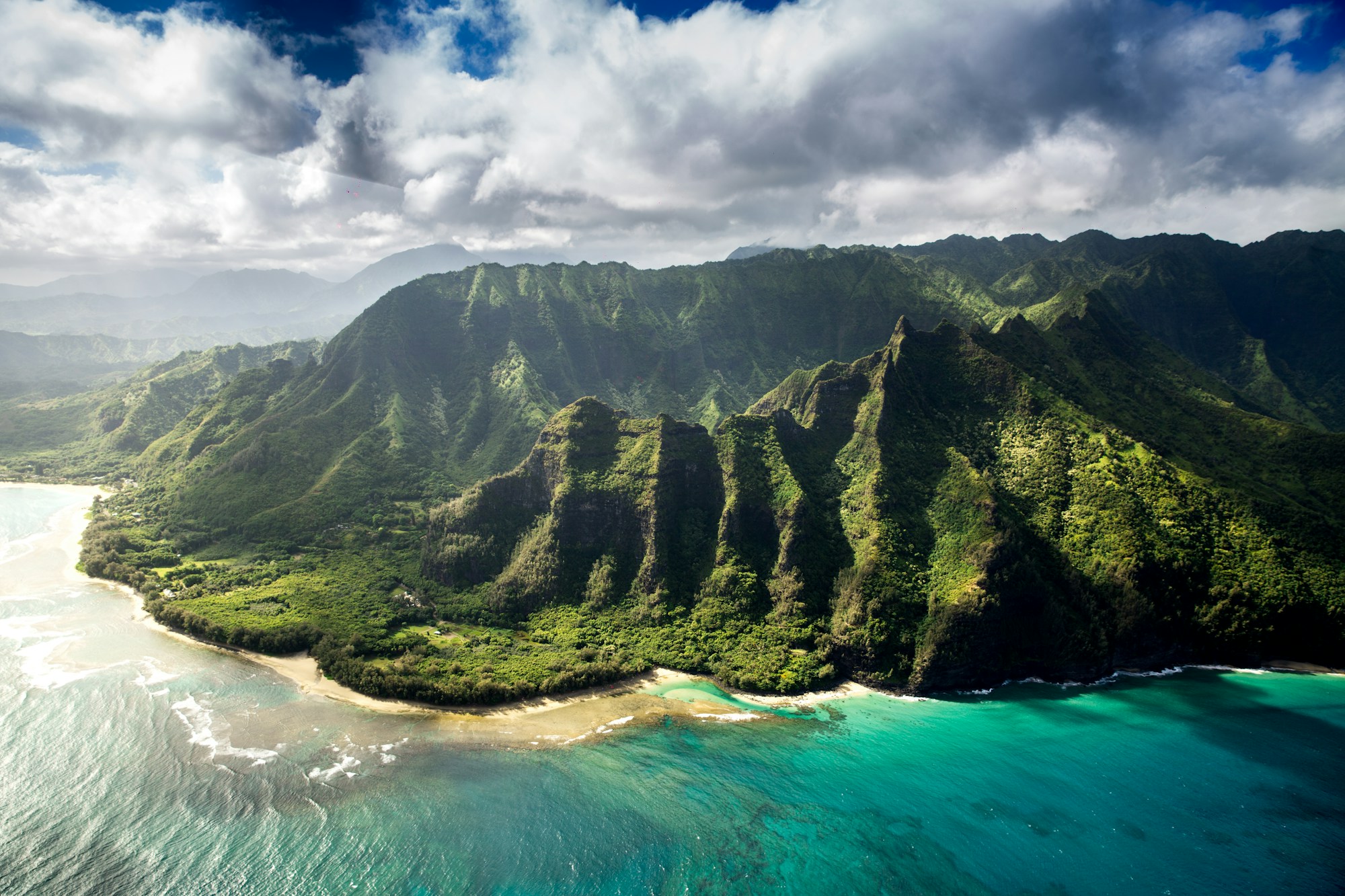 Green Hawaiian mountains and Pacific coastline